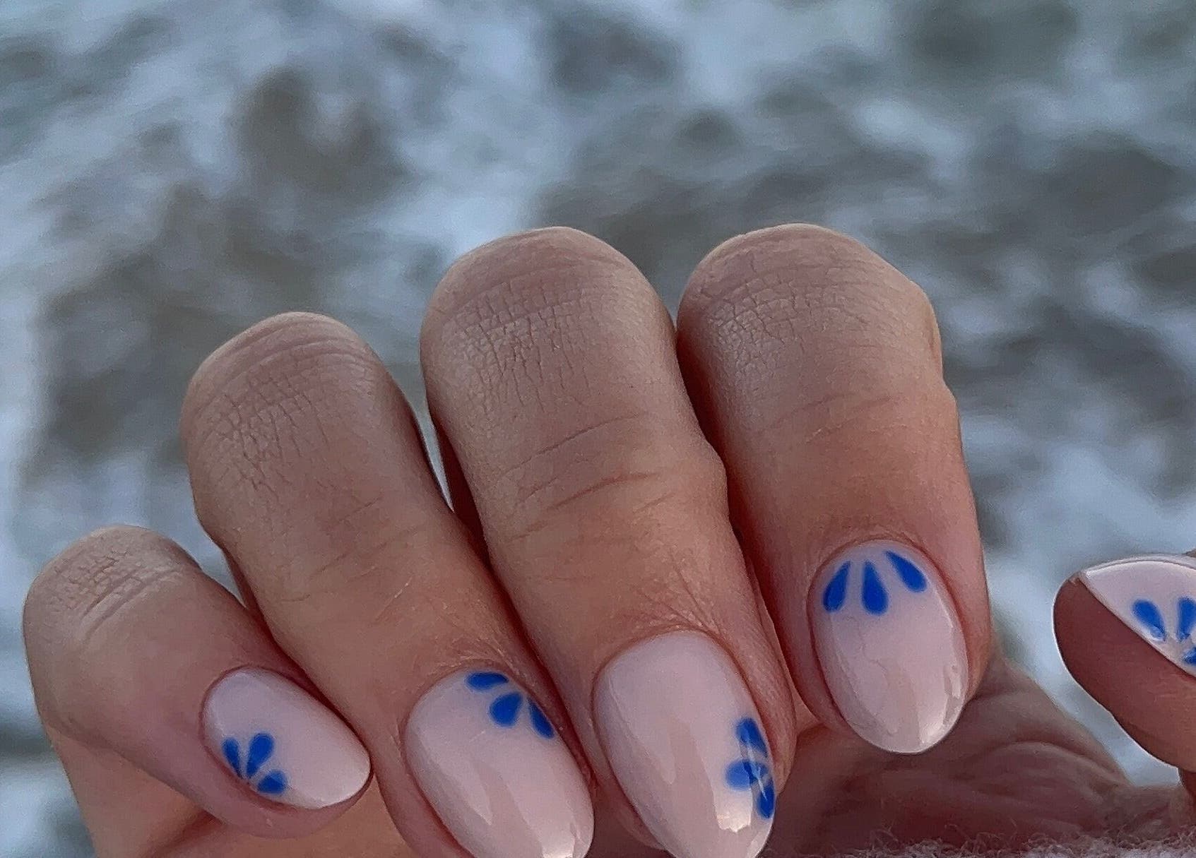 Close-up of stylish blue petal nail art at Nails by Fallon, Rose Bay, New South Wales, AU.