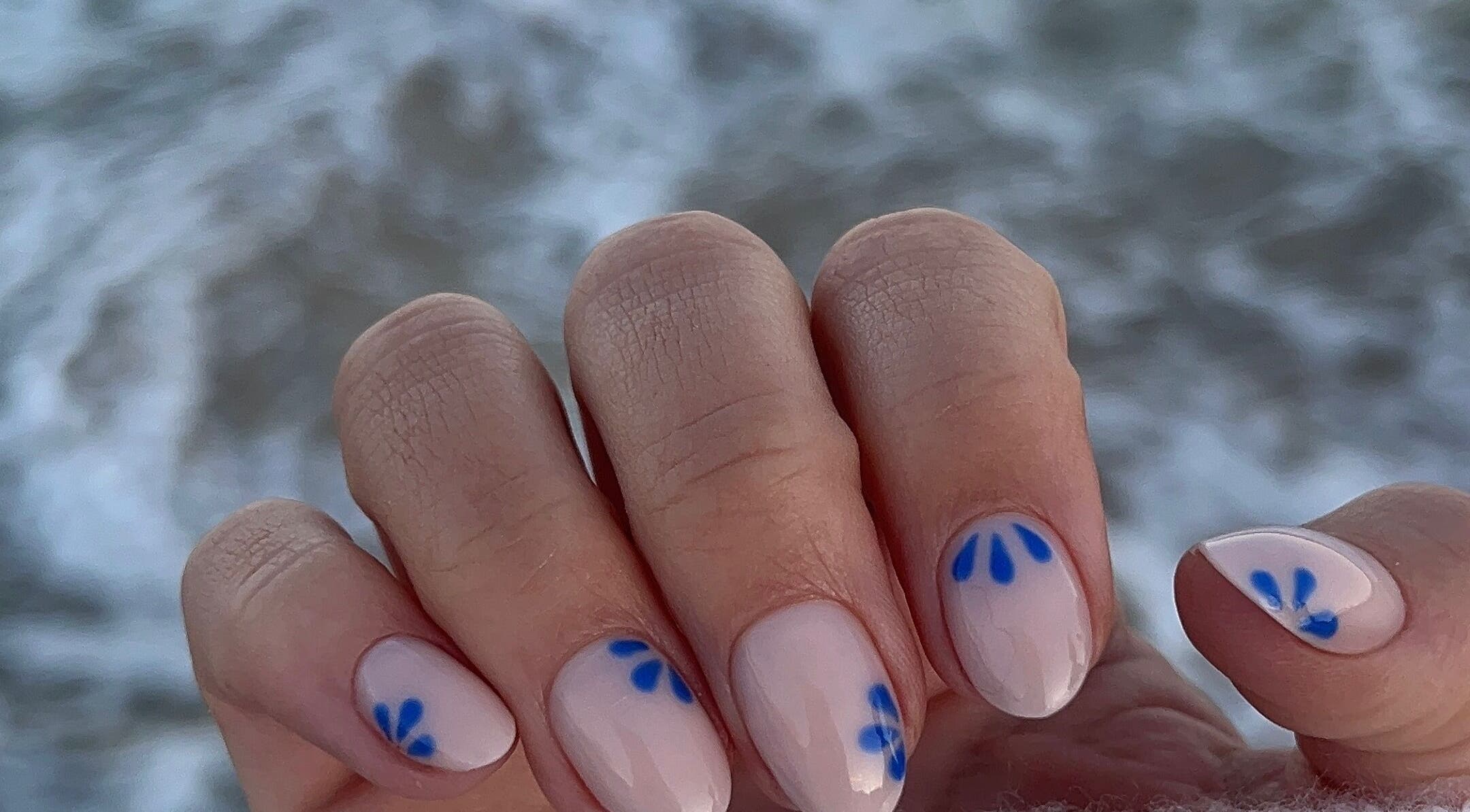 Close-up of stylish blue petal nail art at Nails by Fallon, Rose Bay, New South Wales, AU.