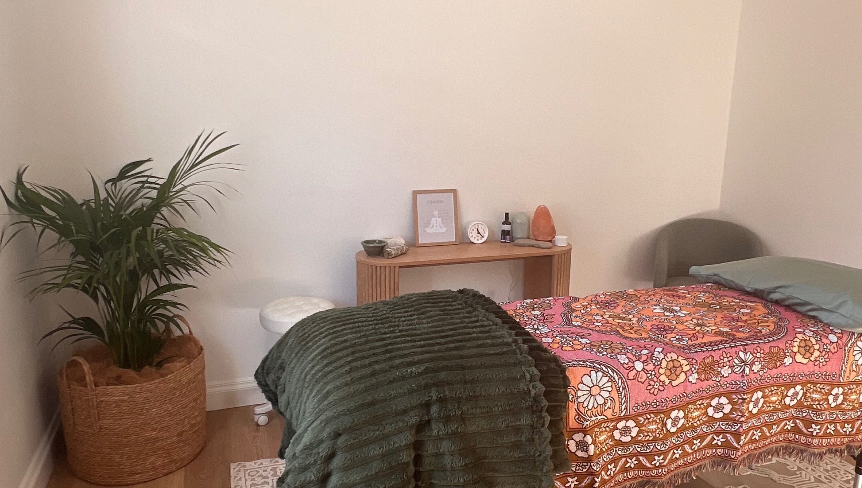 Recharge Reiki Studio room with a cozy bed, plants, and decor in Glengowrie, South Australia, AU.