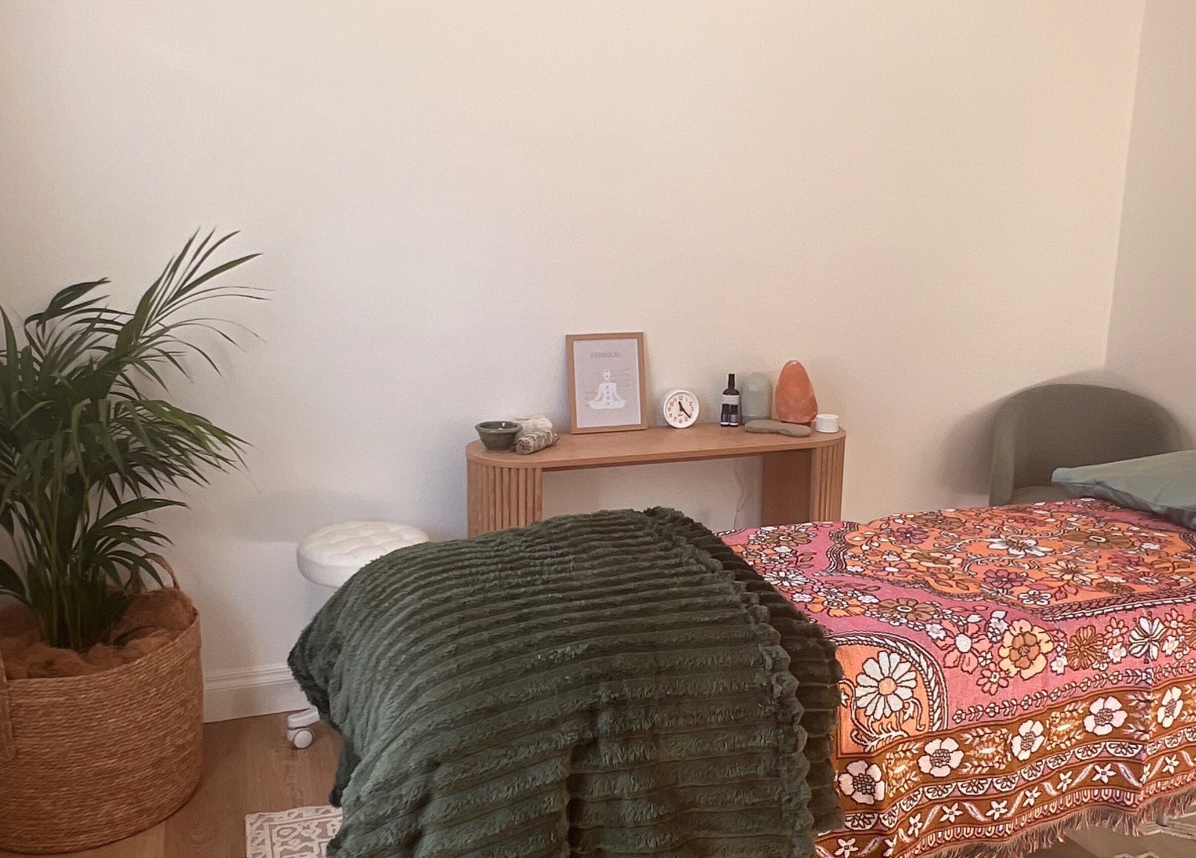 Recharge Reiki Studio room with a cozy bed, plants, and decor in Glengowrie, South Australia, AU.