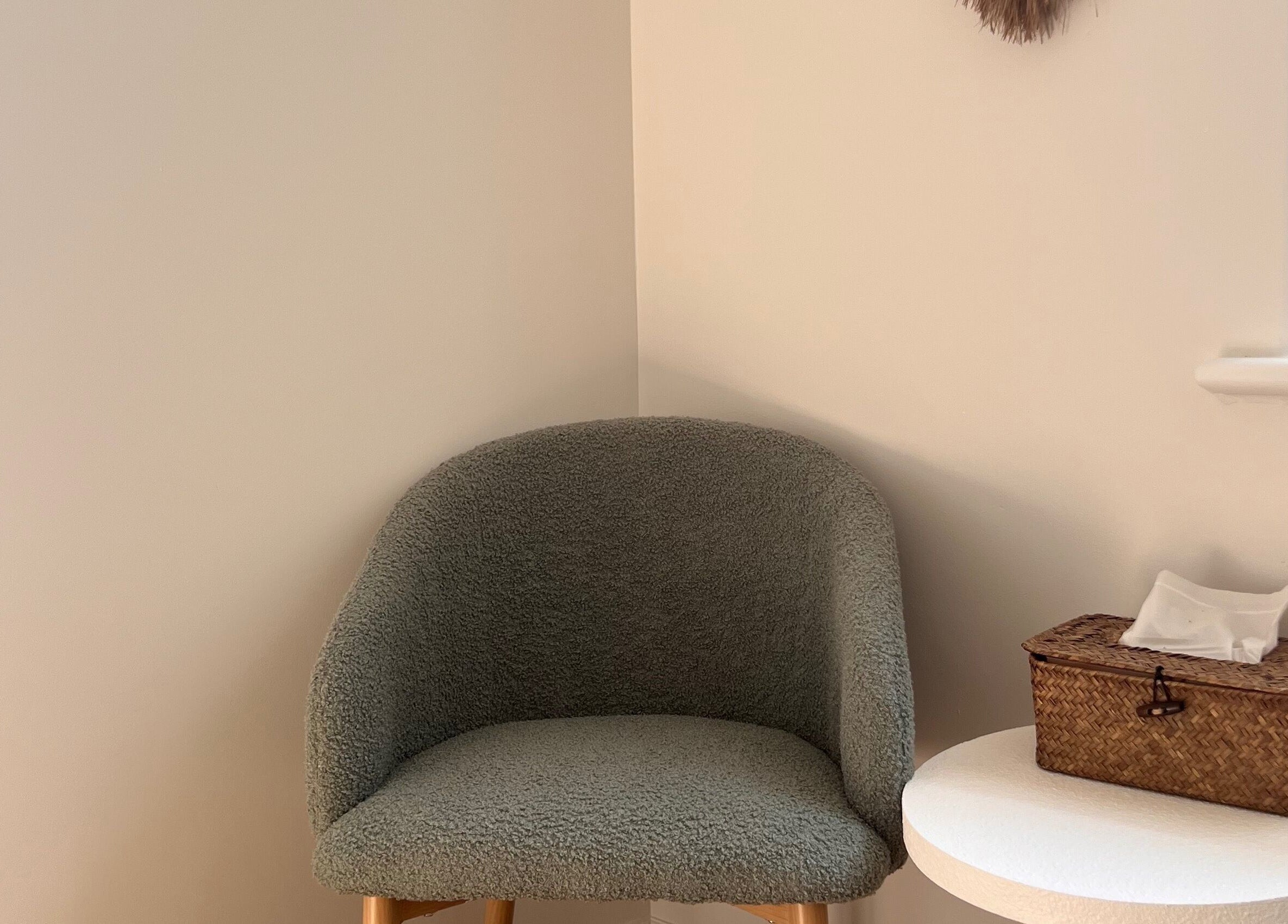 Cozy chair and wicker basket in a serene room at Recharge Reiki Studio, Glengowrie, South Australia, AU.