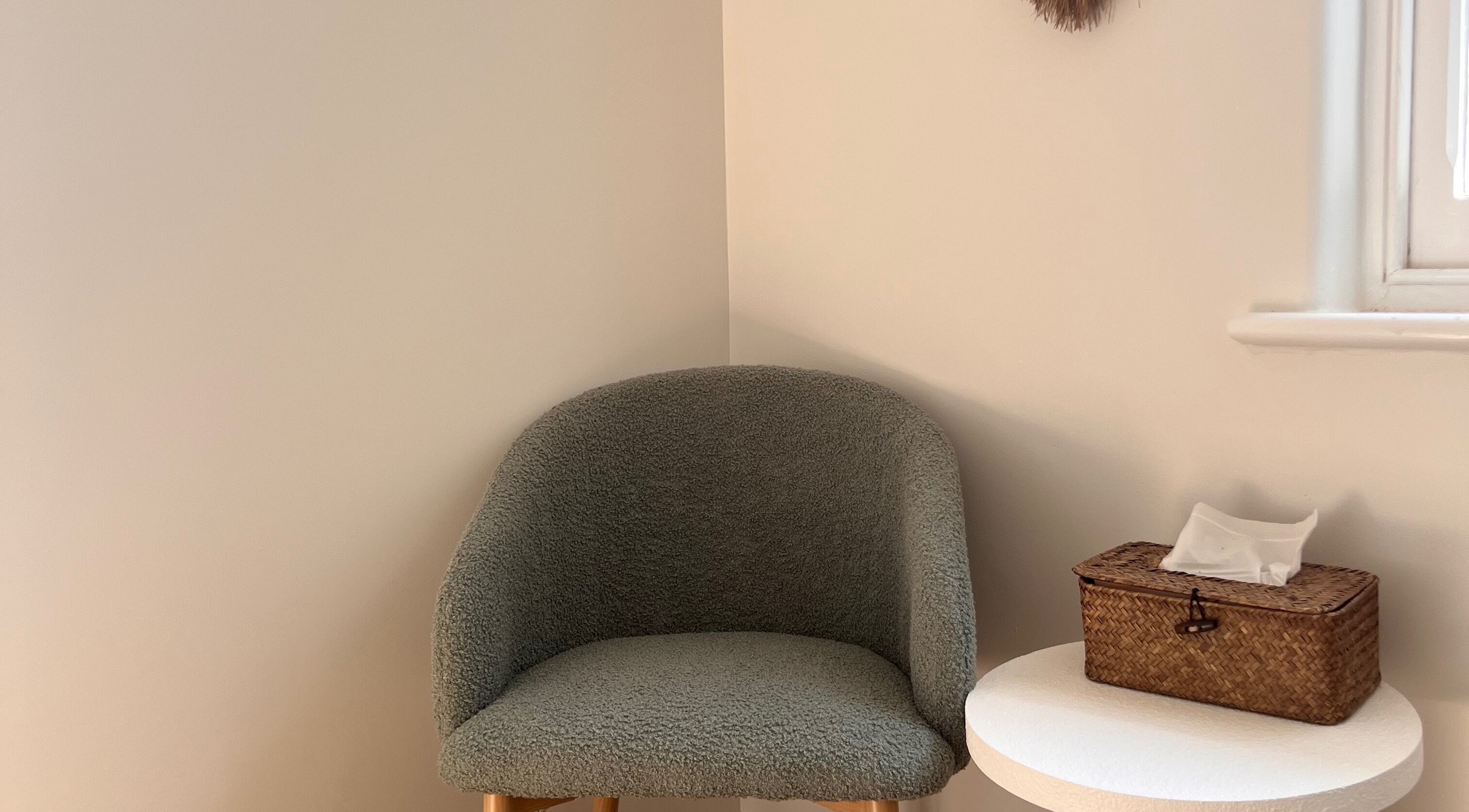 Cozy chair and wicker basket in a serene room at Recharge Reiki Studio, Glengowrie, South Australia, AU.