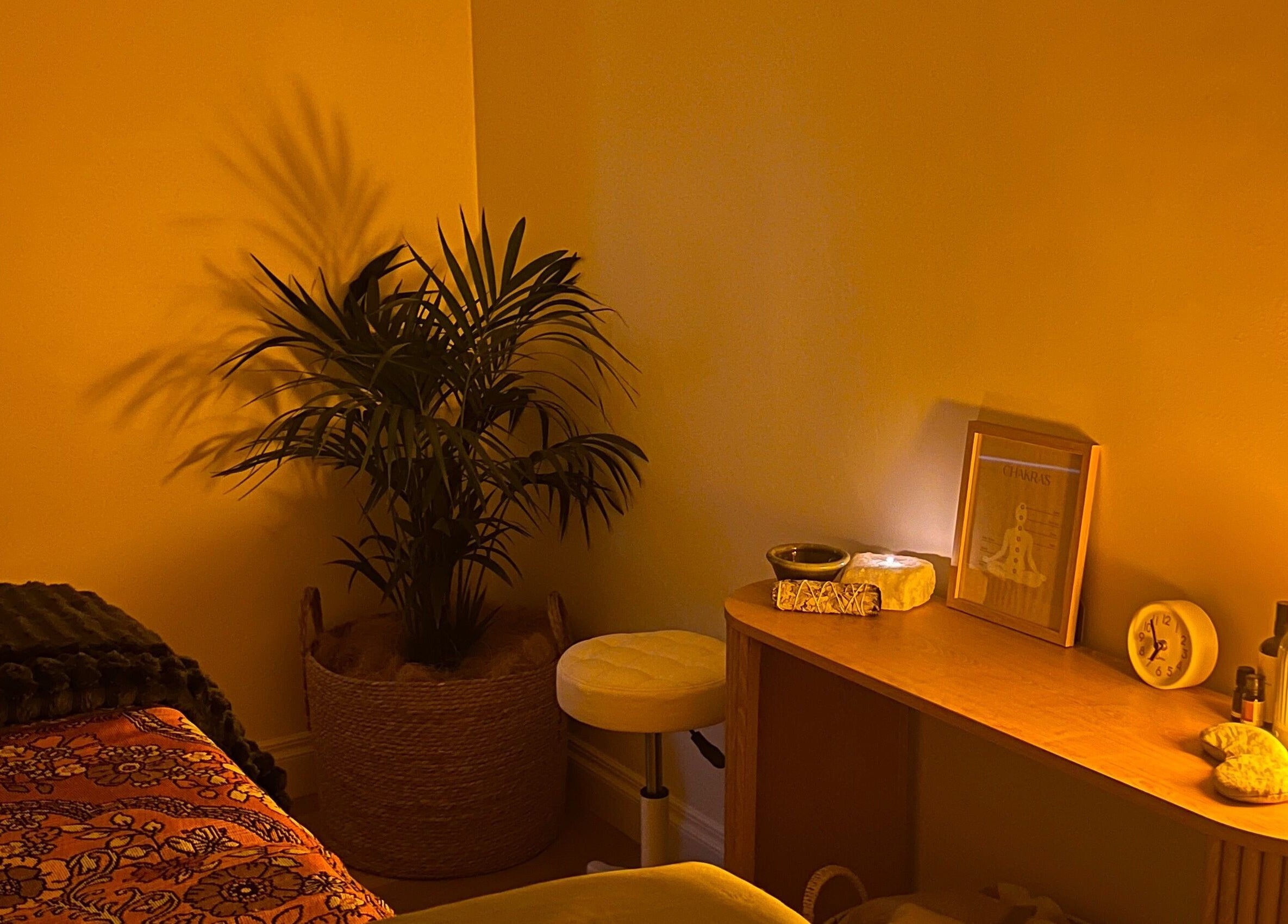 Peaceful corner of Recharge Reiki Studio, Glengowrie, South Australia with serene lighting and decor.