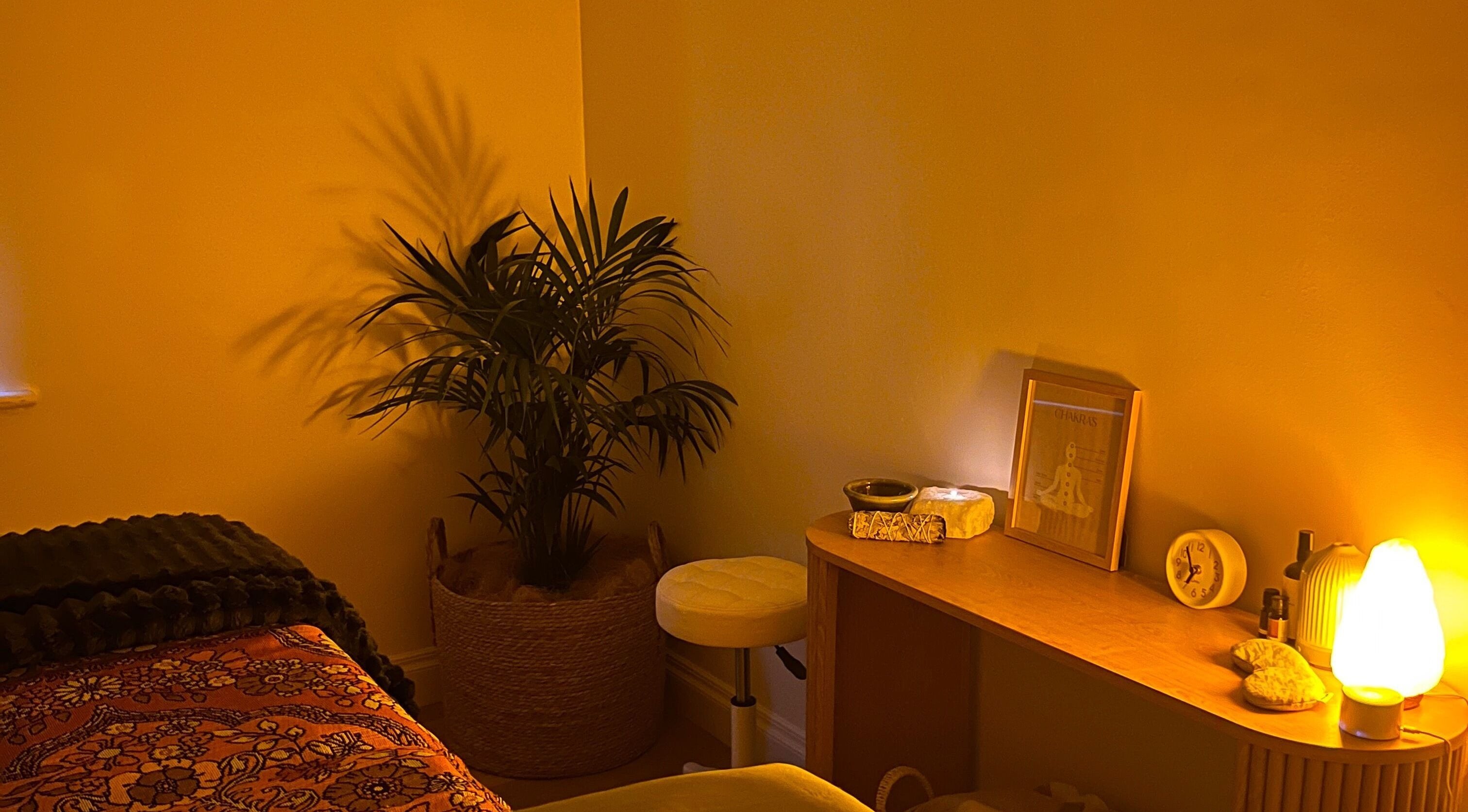 Peaceful corner of Recharge Reiki Studio, Glengowrie, South Australia with serene lighting and decor.