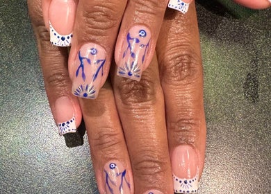Elegant blue and white nail art at Manifested Nails in Port Jervis, New York, US.