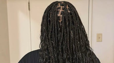 Intricate braids showcased at GELA'SHAIR, Ottawa, Ontario, CA, highlighting expert hair styling.