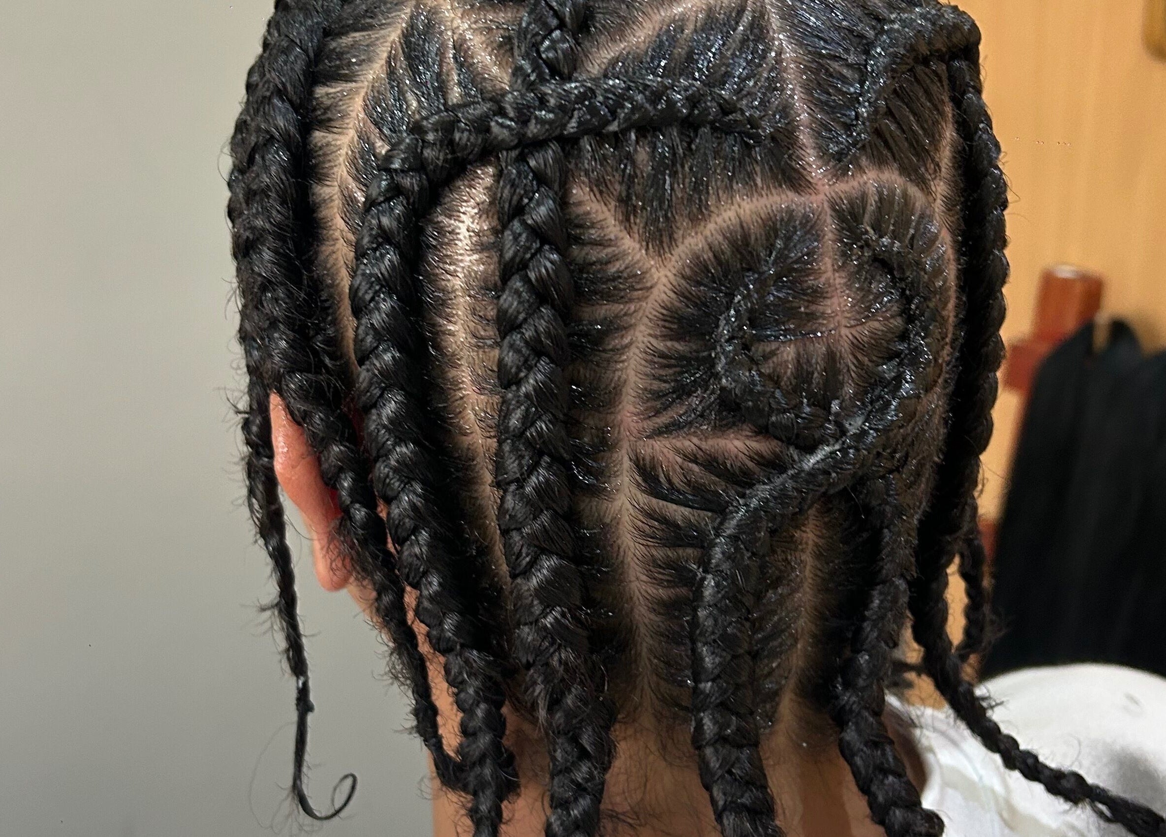 Intricate braiding style at Braidbabes, Cape Town, Western Cape, ZA showcasing creative hair artistry.