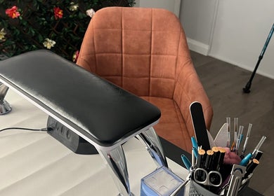 Elegant manicure setup at Get Em Treatments, Aberdeen, Scotland, GB. Features comfy chair and nail tools.