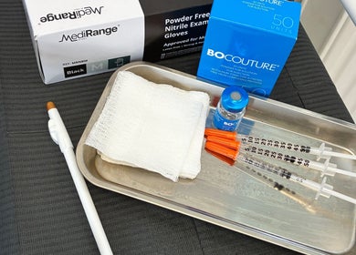 Medical supplies at Weymouth Aesthetics Clinic in Weymouth, England, GB, including syringes and gauze.