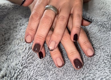 Stylish nail art at Ashley’s Beauty Bar, Huntly, Scotland, GB featuring dark and nude tones.