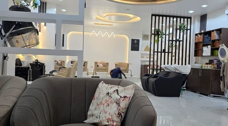 Chic salon interior at Lavish Style, Dar Es Salaam, TZ featuring plush seating and modern decor.