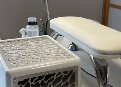 Elegant manicure station at NailEdit Studio, Dublin, IE, featuring modern tools and a sleek white design.