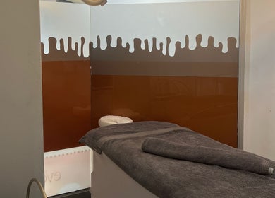 Relaxed massage room at Meraki Lesotho Spa, Maseru, Maseru, LS with cozy towels and calming decor.