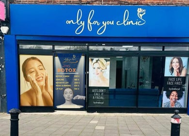 Exterior of Only For You Clinic in Perivale, England, GB showcasing beauty service posters.