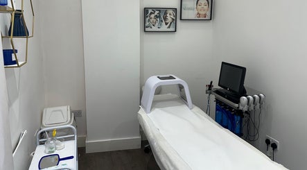 Modern treatment room at Only For You Clinic, Perivale, England, GB, showcasing advanced skincare equipment.