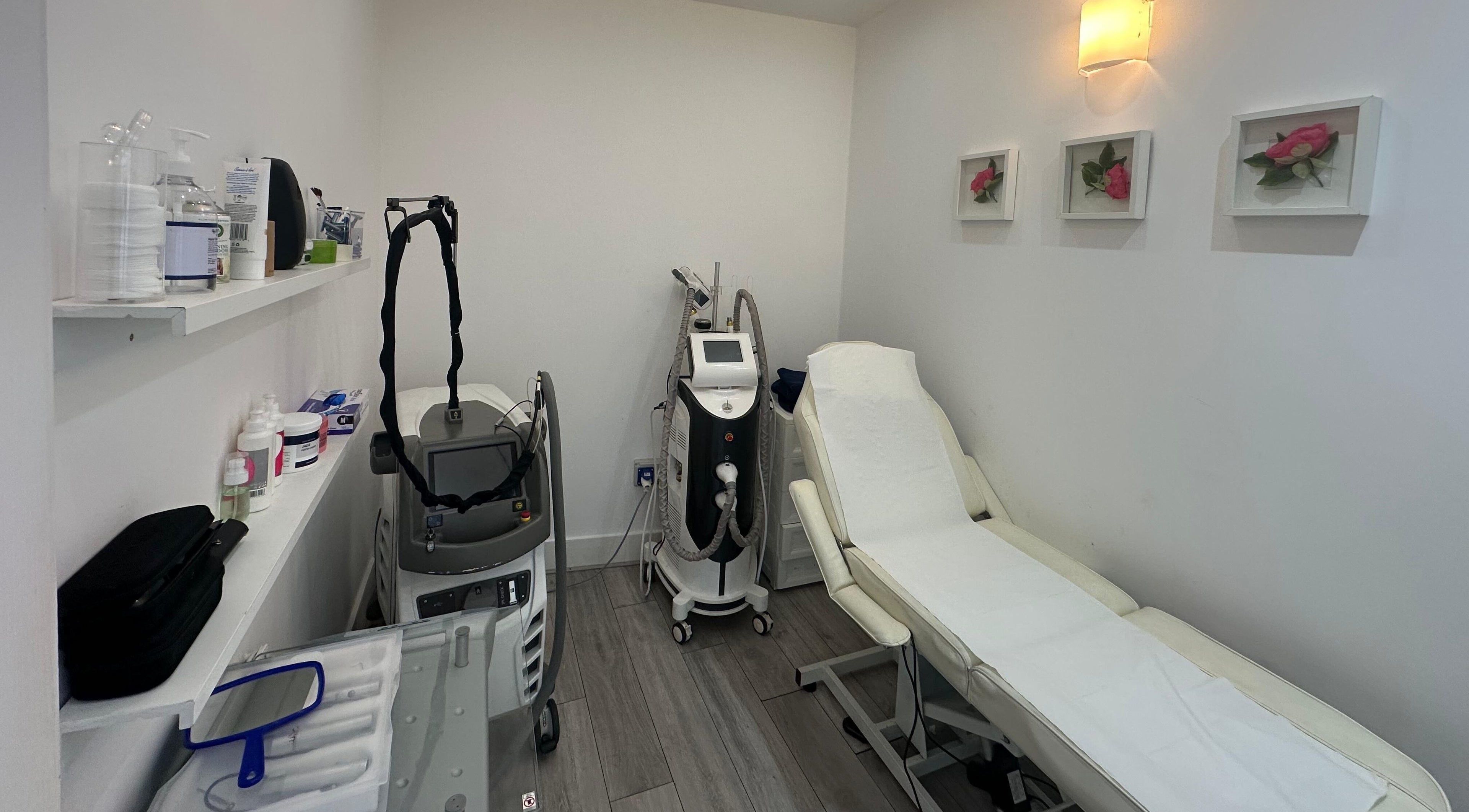 Modern treatment room at Only For You Clinic, Perivale, England, GB, showcasing sleek equipment and serene decor.