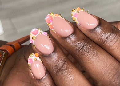 Elegant gem-studded nails at Manpreet Nail Studio, London, England, GB reflecting exquisite craftsmanship.