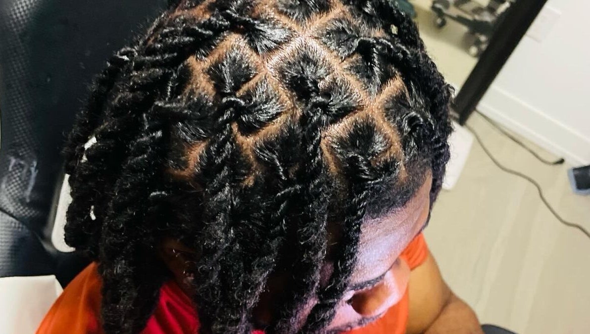 Stylish locs hairstyle at Chindo Locs in Toronto, Ontario, CA, showcasing intricate hair design.