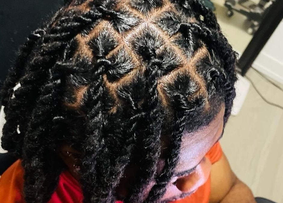 Stylish locs hairstyle at Chindo Locs in Toronto, Ontario, CA, showcasing intricate hair design.