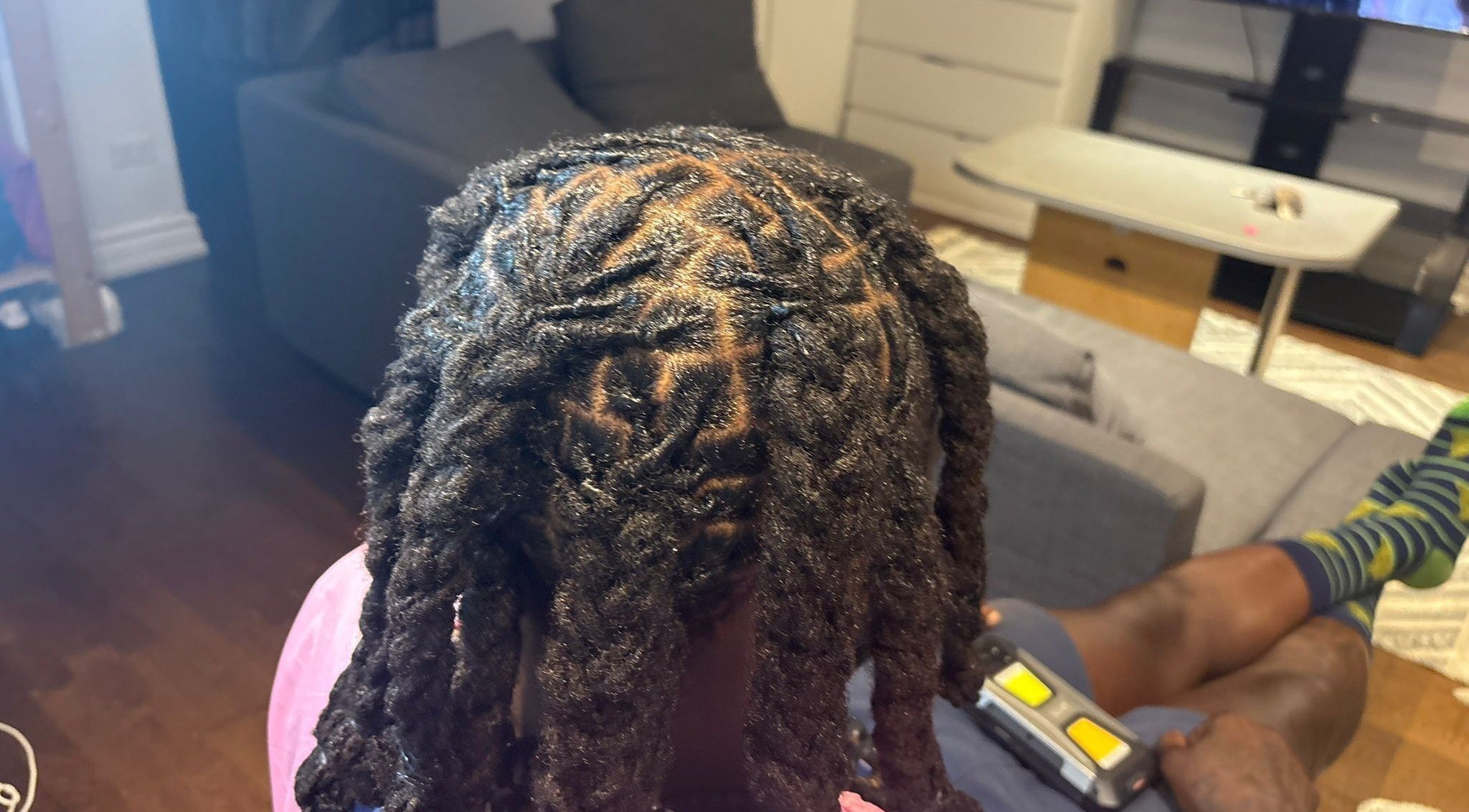 Beautiful locs styled at Chindo Locs in Toronto, Ontario, CA, showcasing expert hair design.