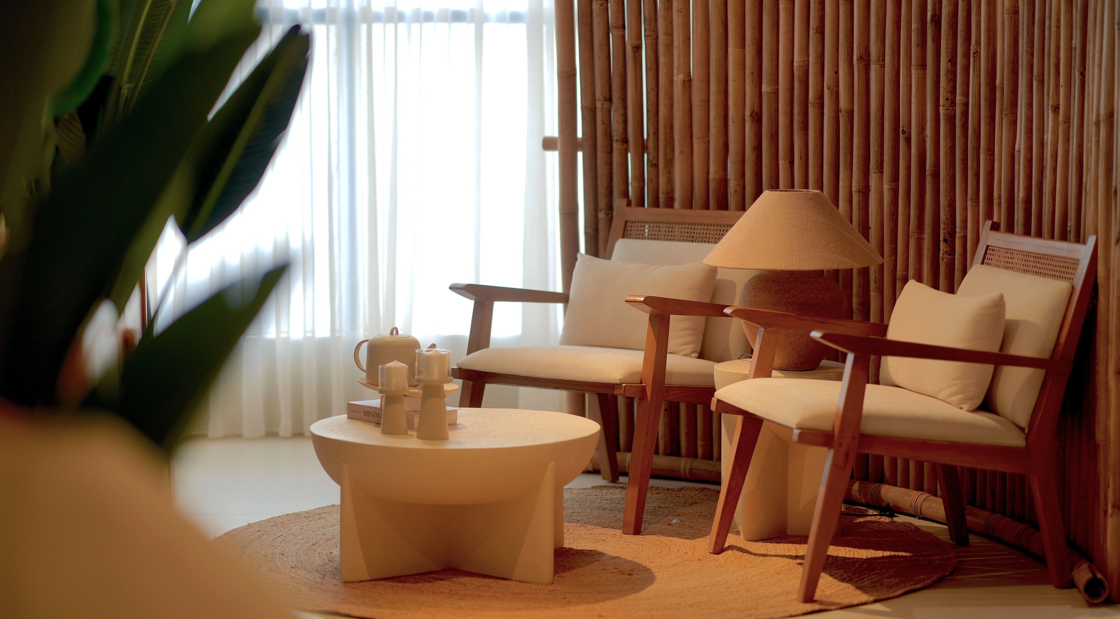 Tranquil seating area at Oia Spa, Al Hofuf, Eastern Province, SA with natural decor and cozy chairs.