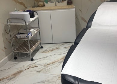 Luxury treatment room at USA Star Beauty, London, England, GB, featuring modern decor and spa essentials.