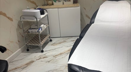Luxury treatment room at USA Star Beauty, London, England, GB, featuring modern decor and spa essentials.