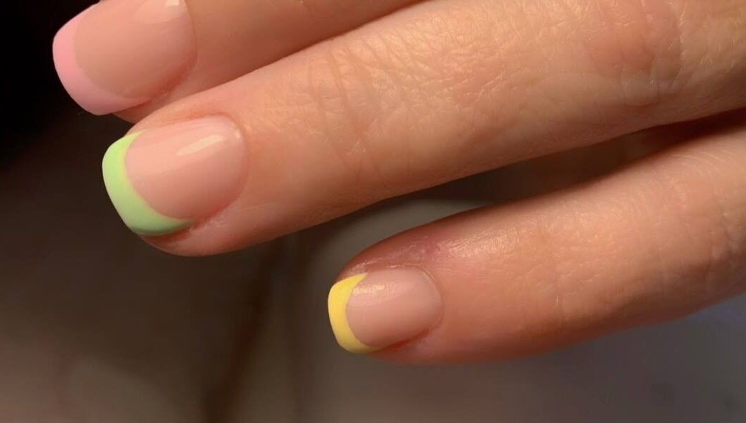 Colorful French manicure at Vicky’s Nails in Gendros, Wales, GB.