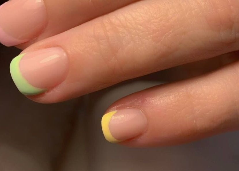 Colorful French manicure at Vicky’s Nails in Gendros, Wales, GB.