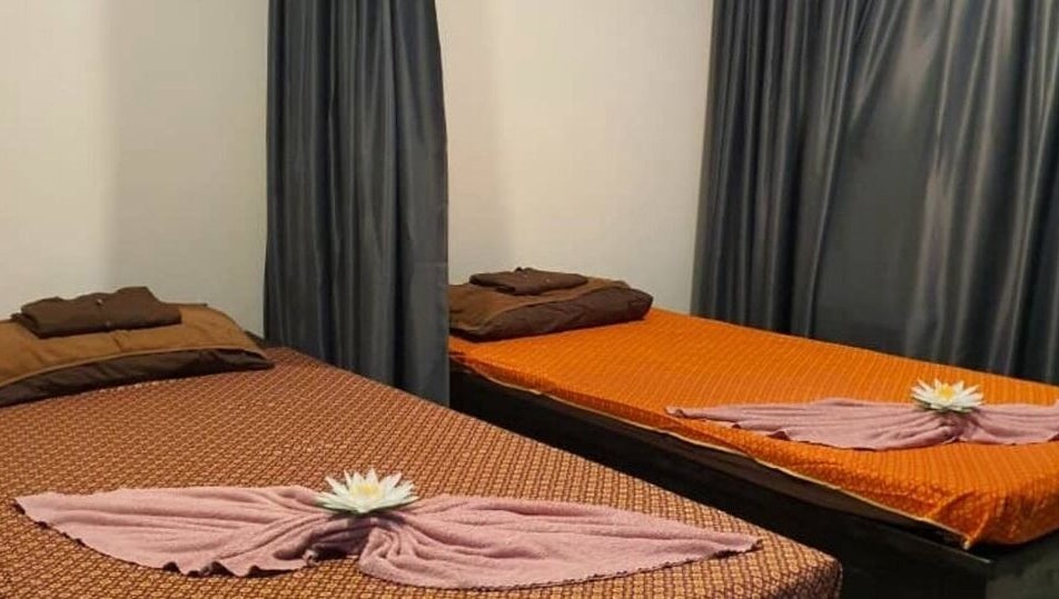 Relaxing massage room at Baan Nathong Massage in Krung Thep Maha Nakhon, offering a tranquil ambiance.