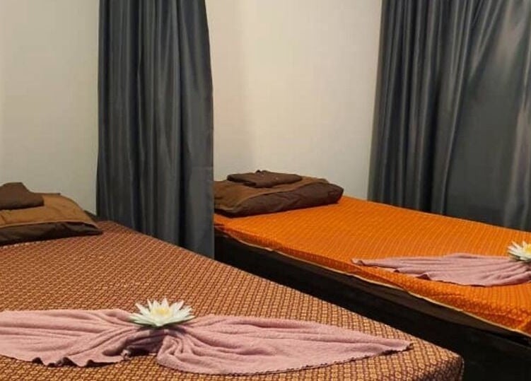 Relaxing massage room at Baan Nathong Massage in Krung Thep Maha Nakhon, offering a tranquil ambiance.