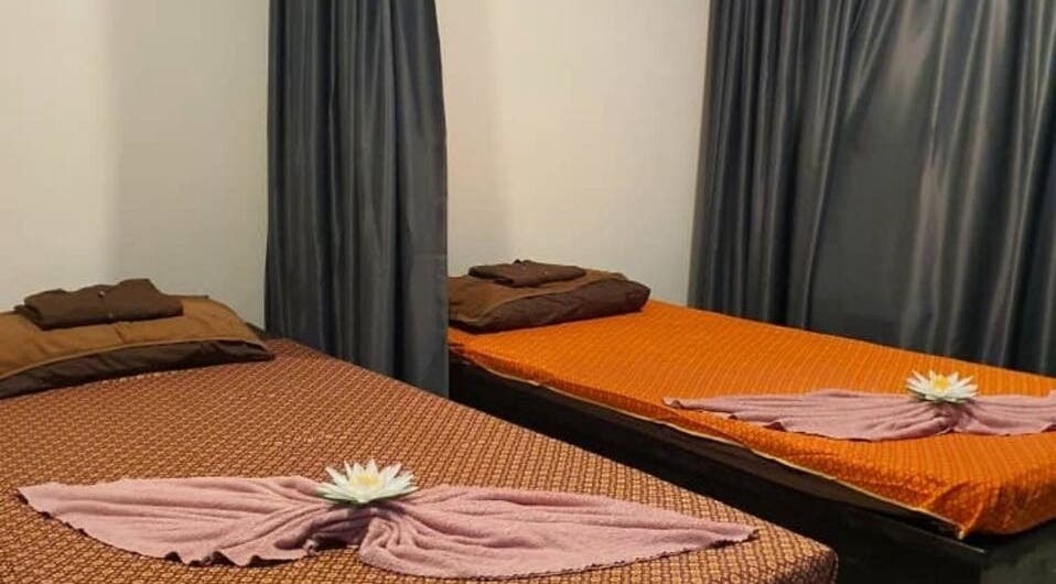 Relaxing massage room at Baan Nathong Massage in Krung Thep Maha Nakhon, offering a tranquil ambiance.