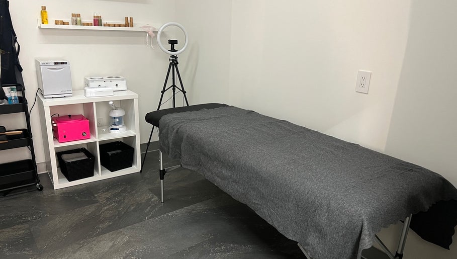 Modern treatment room at Sérénité Bloom, Oakville, Ontario, CA, featuring a comfortable massage table.