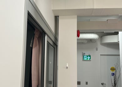 Interior hallway of Sérénité Bloom in Oakville, Ontario, CA with sleek design and safety features.