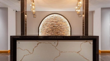 Luxurious reception at Wellness 360 Spa At Hotel Retlaw in Fond Du Lac, Wisconsin, US, highlighted by modern design.