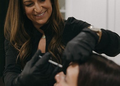 Aesthetician provides treatment at Wellness 360 Spa At Hotel Retlaw, Fond Du Lac, Wisconsin, US.