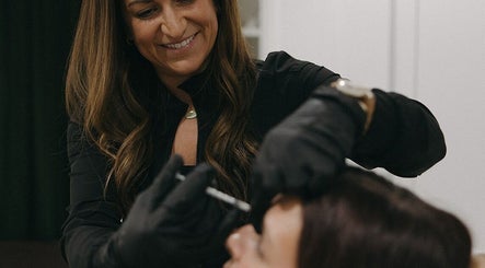 Aesthetician provides treatment at Wellness 360 Spa At Hotel Retlaw, Fond Du Lac, Wisconsin, US.