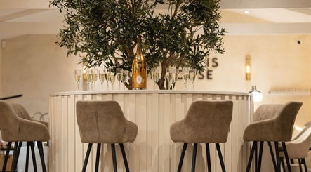 Elegant lounge at Ramona Cicortas in Telford, England featuring chic seating and decor.