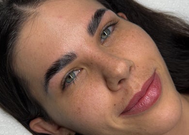Close-up of well-groomed brows and skin at Arch Aesthetic, Palm Beach, Queensland, AU.