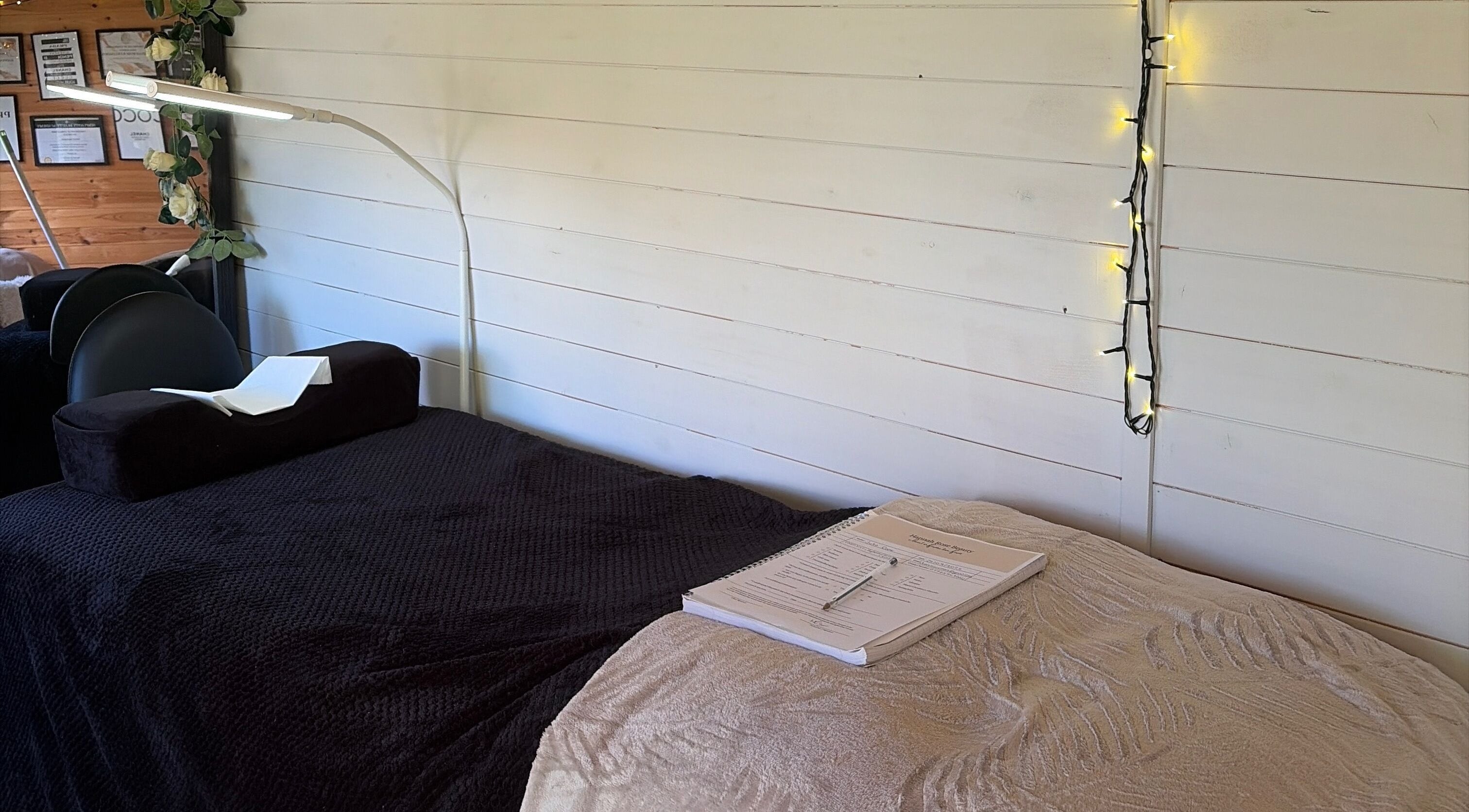 Calm treatment room setup at Hr Beauty Studio, Sandiacre, England, GB, featuring a cozy spa bed and soft lighting.