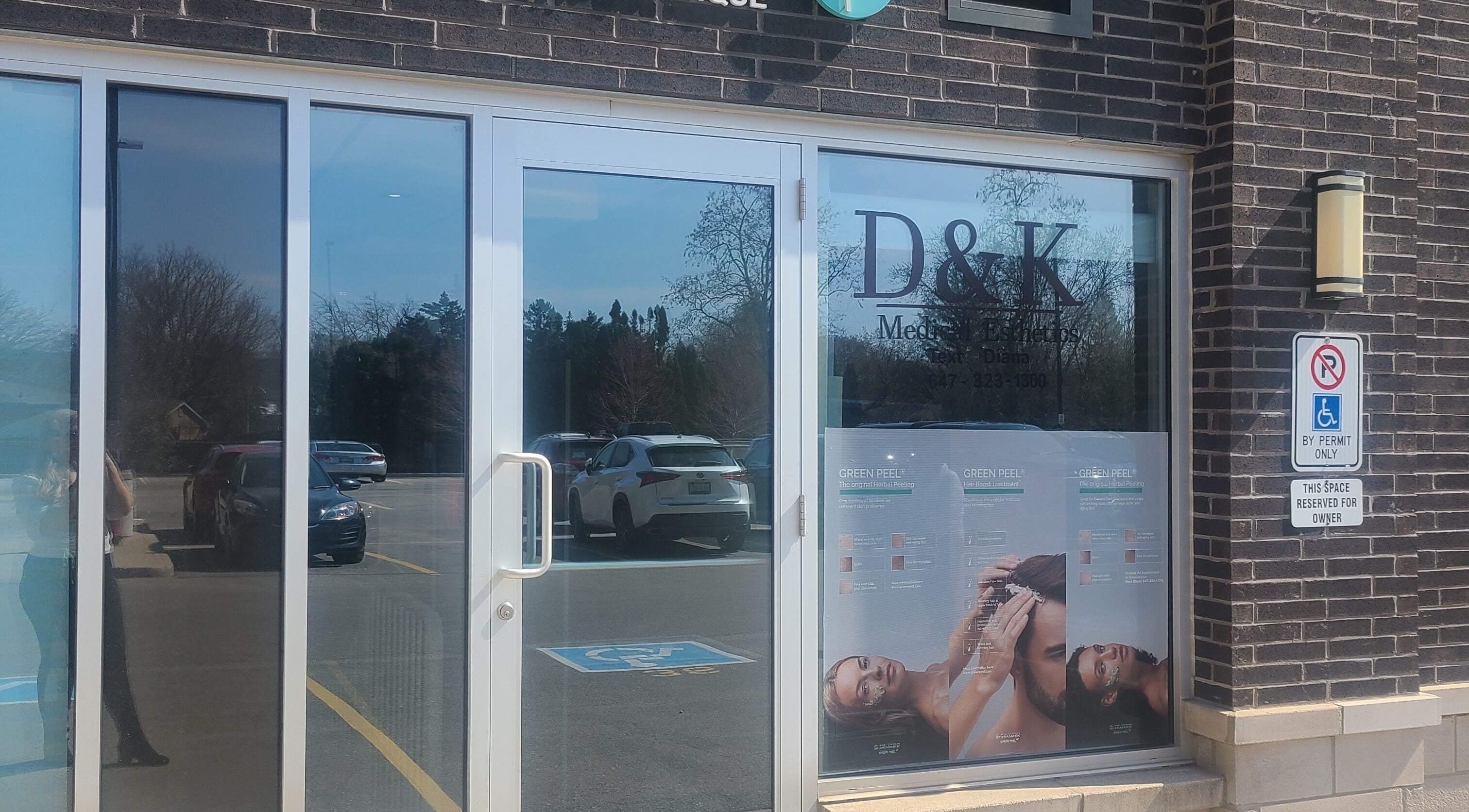 Front entrance of D&K Medical Esthetics, Grimsby, Ontario, CA featuring glass doors and signage.