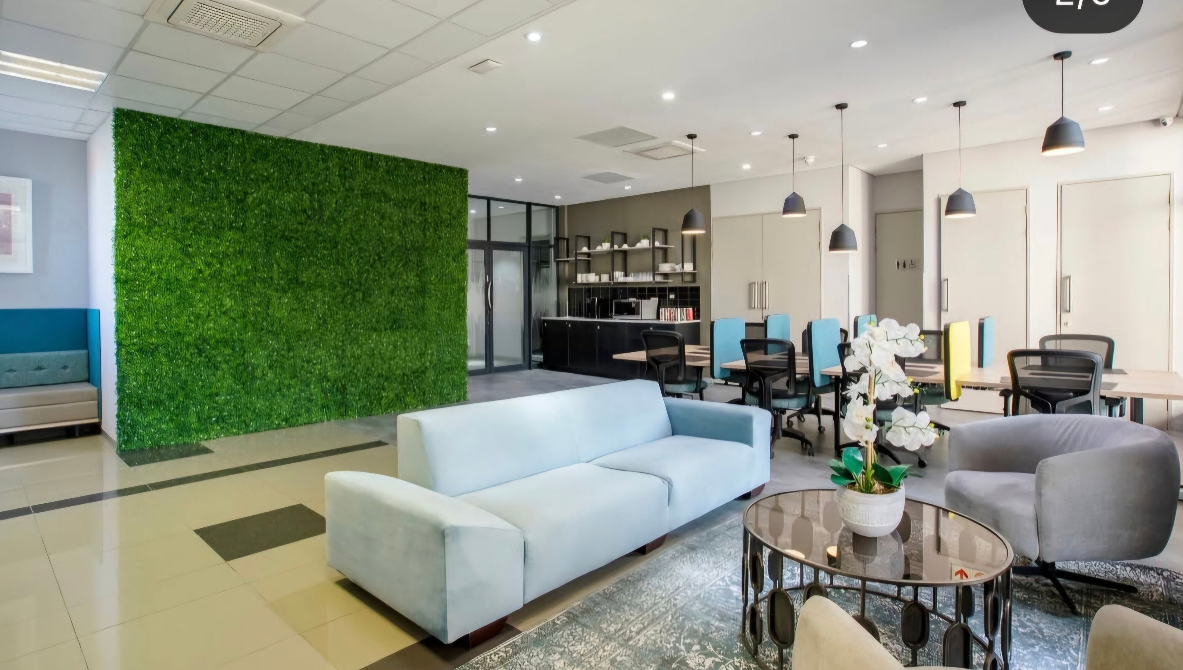 Modern lounge at Déjà Vu Aesthetics, Sandton, Gauteng, ZA with green feature wall and sleek furnishings.