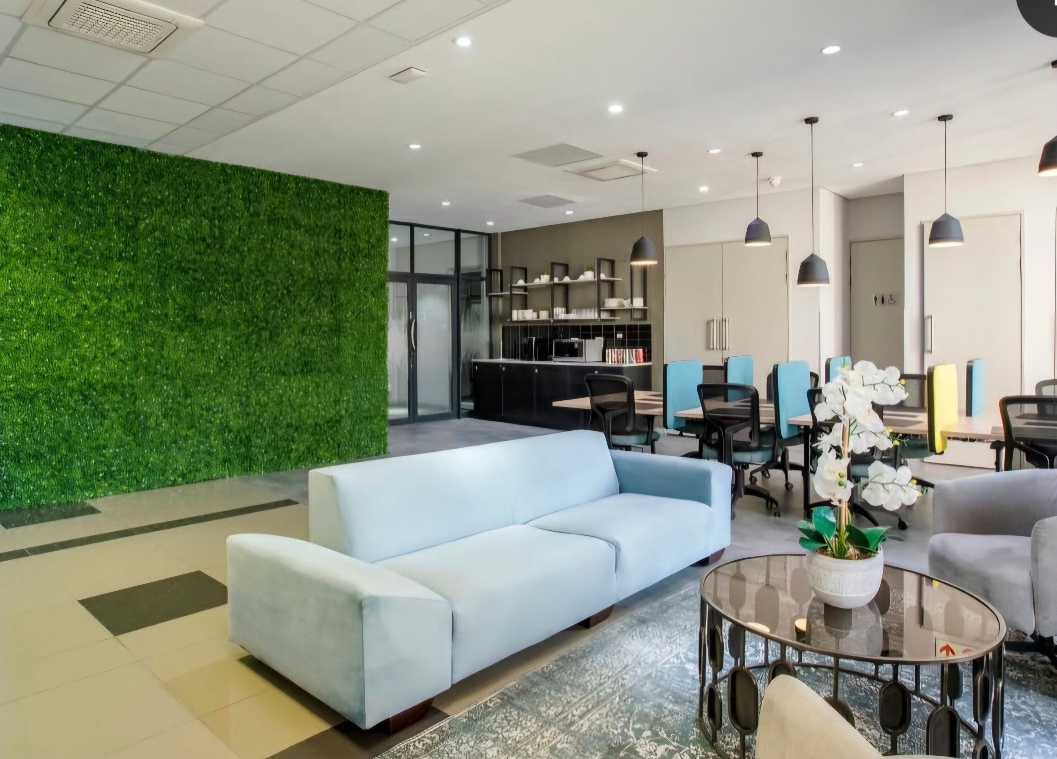 Modern lounge at Déjà Vu Aesthetics, Sandton, Gauteng, ZA with green feature wall and sleek furnishings.