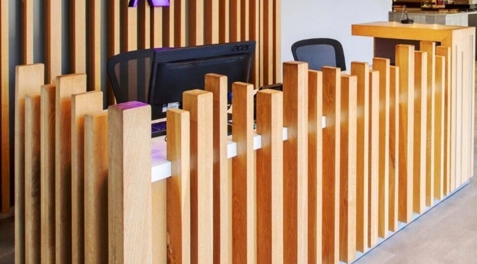 Modern wooden reception at Déjà Vu Aesthetics, Sandton, Gauteng, ZA showcasing stylish interior design.