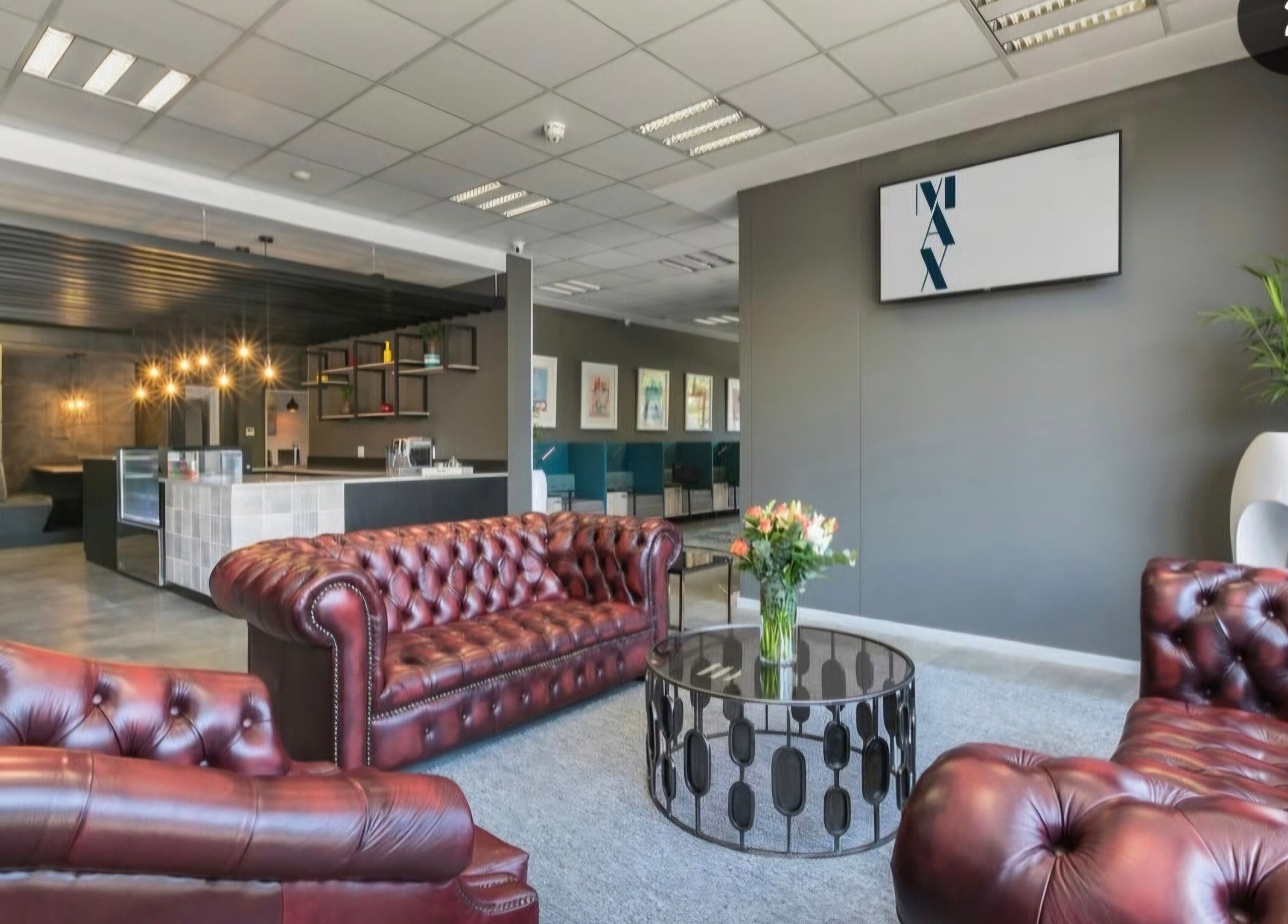 Luxurious lounge area at Déjà Vu Aesthetics, Sandton, Gauteng, ZA with leather sofas and chic decor.