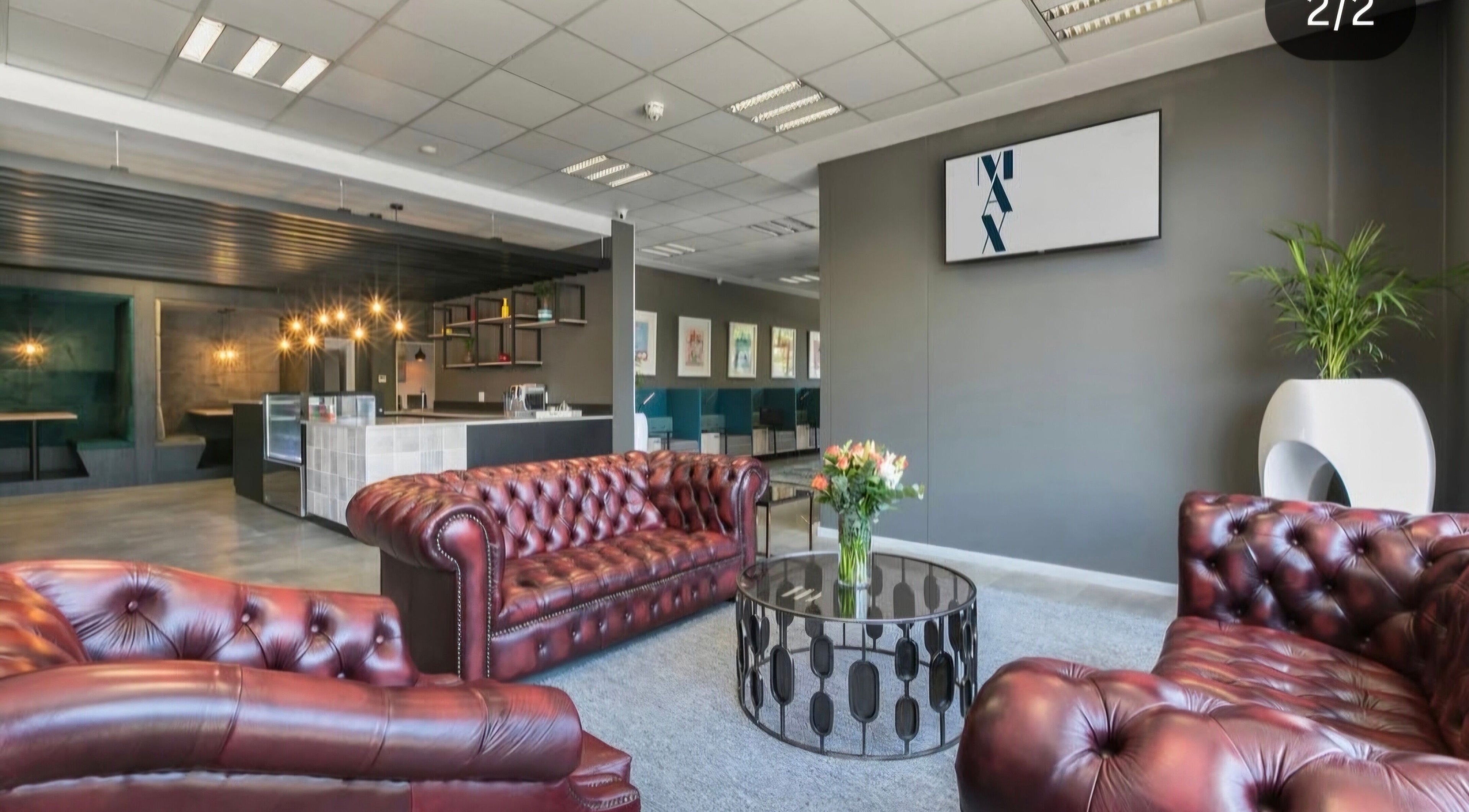 Luxurious lounge area at Déjà Vu Aesthetics, Sandton, Gauteng, ZA with leather sofas and chic decor.
