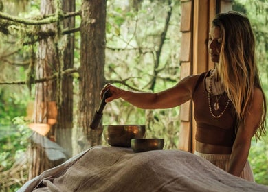 Therapist performing sound healing at Body Elements Heal, Tofino, British Columbia, CA.