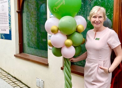 Warm welcome at Saltash Massage Therapy Zen with Zuzana, Saltash, England, GB. Smiling staff by green balloons.