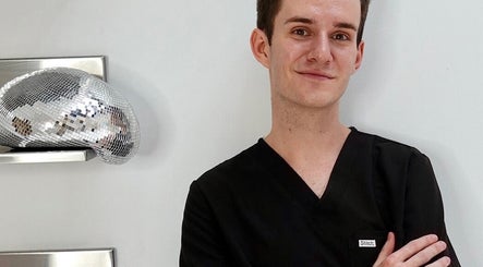 Nurse in uniform at JEI Clinic, Randwick, New South Wales, AU offers professional beauty services.