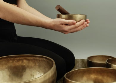 Hands holding a singing bowl at SMENA Healing Studio, Melbourne, Victoria, AU for relaxation.